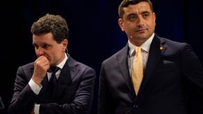 Presidential candidates Nicusor Dan, left, and George Simion during a live electoral debate ahead of the second round of the country's presidential election redo in Bucharest, Romania, Thursday, May 8, 2025. (AP Photo/Andreea Alexandru)