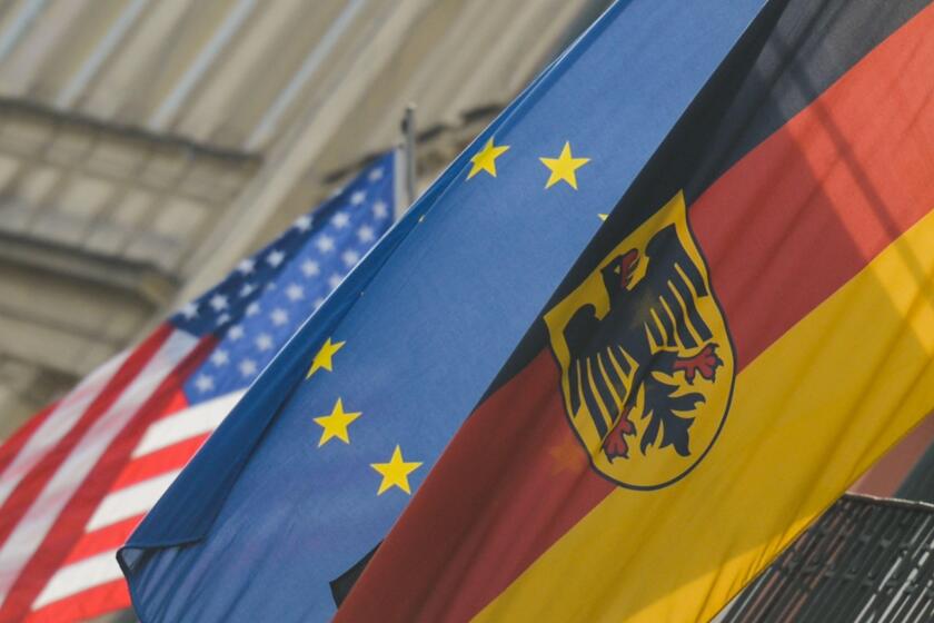 A view of German, EU and US flags in Krakow's center. On January 14, 2020, in Krakow, Poland. (Photo by Artur Widak/NurPhoto)