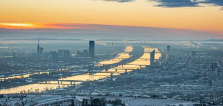 Vienna, Austria in Europe. Panoramic view to the city and the danube river from Kahlenberg hill to the snow covered city.
