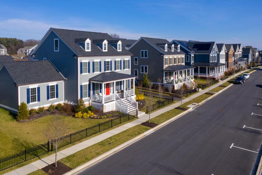 Aerial view of typical upper class American single family real estate homes with vinyl siding and brick facade in the East Coast of the United States