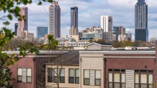 Atlanta, Georgia skyline beyond urban residential area on the east side of the city. (USA)