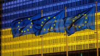 Belgium, Brussels, May 2022: facade of the Berlaymont building , headquarters of the European Commission, lit up in the colours of the Ukrainian flag.