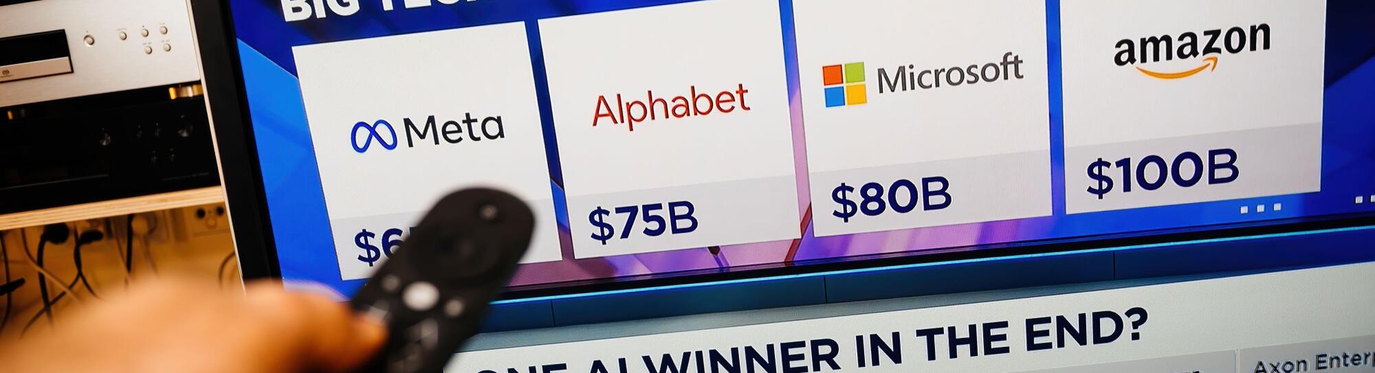 Paris, France - Feb 19, 2025: A person holds a remote while watching CNBC on a Panasonic TV, displaying Meta, Alphabet, Microsoft, and Amazon 2025 cap