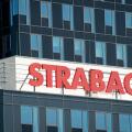 Strabag name plate red sign and logo on blue glass office building, Sofia Bulgaria, Eastern Europe, Balkans, EU