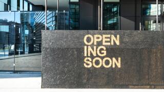 the writing Opening Soon in a building site in Milan, Italy