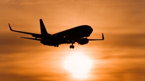 Aircraft against setting sun