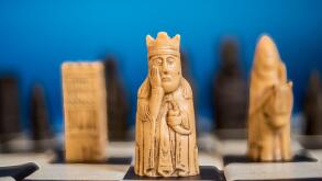 Lewis Chess pieces on chess board.