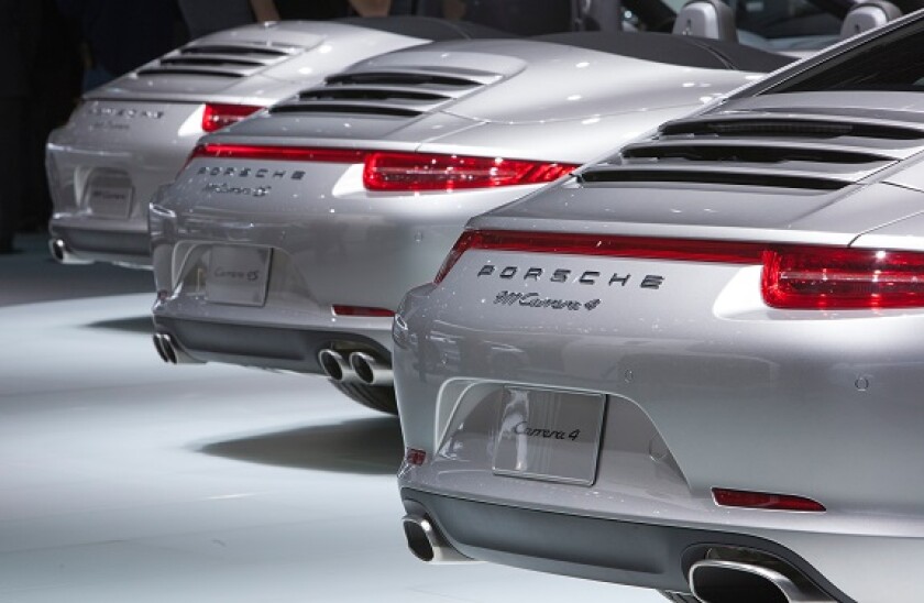 Detroit, Michigan - Several models of the Porsche Carrera on display at the North American International Auto Show.