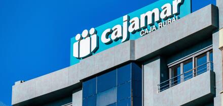 Alicante, Spain, logo or business sign of Cajamar on top of a building. The company offers financial services.