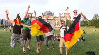 Football fans celebrate the German national football team's entry into the semi-finals at the Reichstag in Berlin, 04.07.2014, Berlin, Germany
