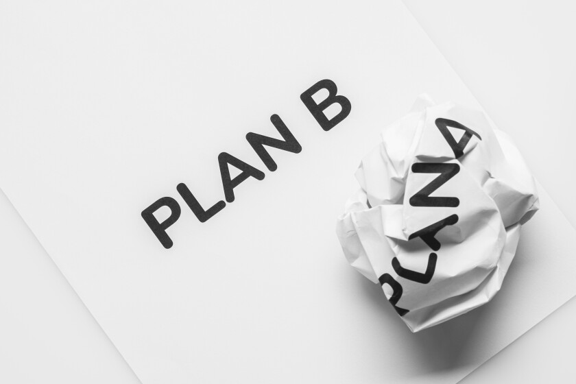 Crumpled paper Plan A and clean sheet paper Plan B on white back