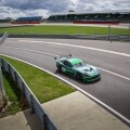 A racing car entering the pits on a track day at Silverstone Racing Circuit, Towcester, England.