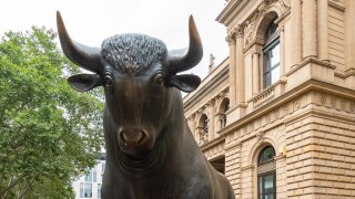 Bull stock market concept - statue of bull outside Frankfurt Stock Exchange, Frankfurt am Main, Germany, Europe
