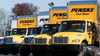 A logo sign and rental trucks outside of a facility occupied by Penske Truck Leasing in Reading, Pennsylvania, on April 22, 2018.
