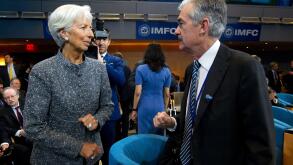 International Monetary Fund (IMF) Managing Director Christine Lagarde speaks with Federal Reserve Board Chair Jerome Powell during the International Monetary and Financial Committee meeting, at the World Bank/IMF Spring Meetings in Washington, Saturday, A