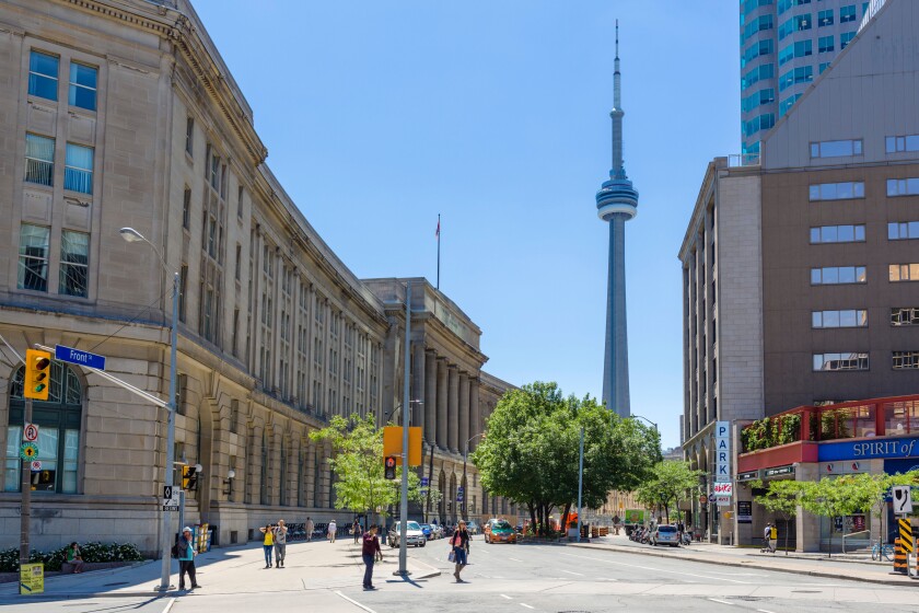 Toronto, Canada. View down Front Street towards the CN Tower with the Dominion Public Building to the left, Toronto, Ontario, Canada