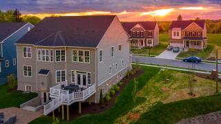 Aerial view of luxury houses in a Maryland upper middle class neighborhood American real estate development in the USA with stunning sunset color sky