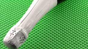 champagne bottle on green background