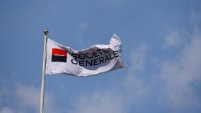 Societe Generale flag flying above the banking business building in Tower Hill, London. Space for copy. Blue sky