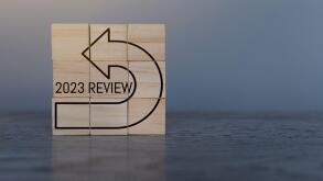 Wooden cubes with text 2023 REVIEW. Copy space for text. Annual review, evaluation and audit concept