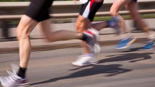 Germany, Baden-Wurttemberg, Stuttgart, Three runners in motion during half marathon