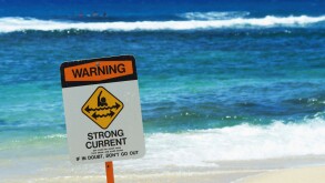 Strong current warning sign at Poipu Beach Park Kauai HI