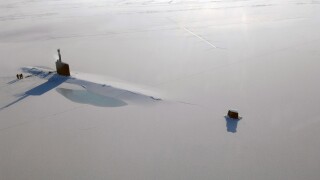The US Navy Los Angeles-class nuclear attack submarine USS Annapolis after breaking through three feet of ice while participating in Ice Exercise March 21, 2009 in the Arctic Ocean.
