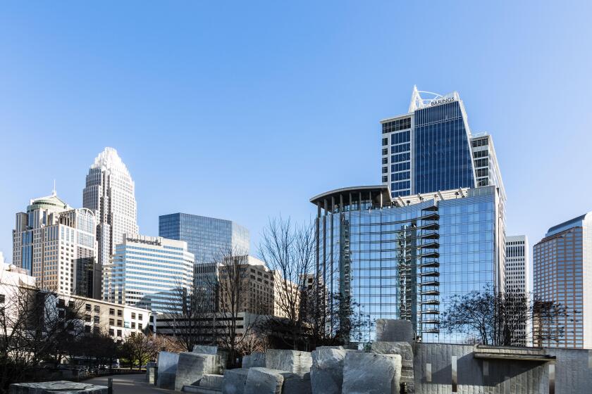 CHARLOTTE, NC, USA-26 JAN 2020: The Charlotte skyline from  Bearden Park in winter, includes  Bank of America Corporate Tower, and the Barings Tower.