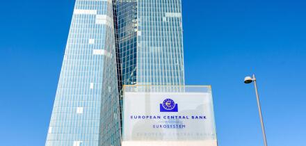 Low angle view of the sign of the European Central Bank at the entrance of the Skytower building in Frankfurt, Germany, seat of the ECB since 2015.