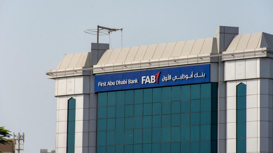"Ras al Khaimah, Ras al Khaimah/United Arab Emirates - 7/4/2019: "First Abu Dhabi (FAB) Bank blue storefront on a blue sky sunny day. "
