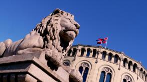 famous lion statue outside parliament building in oslo, norway
