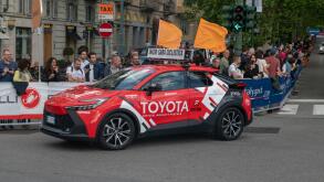 Giro d'Italia sponsors teams at the great cycling race, with technical support teams and cars. pink sweater, tour of italy 2024, turin, italy, 4 may 2