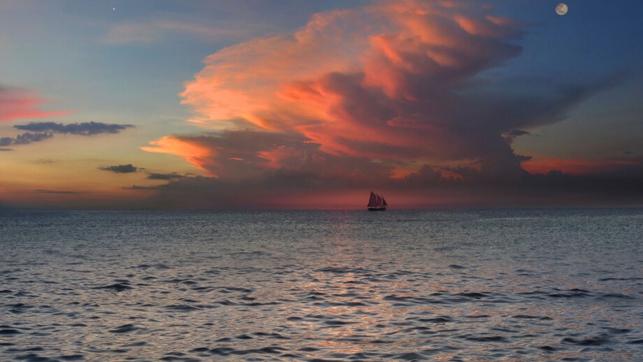 View of sloop on the horizon at sunset, Boracay, Philippines, Asia