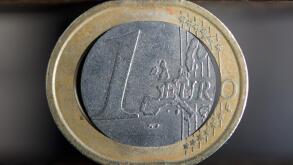 ILLUSTRATION - This illustration shows a damaged euro coin in a vise in Stuttgart, Germany, 15 December 2011. Photo: Michele Danze