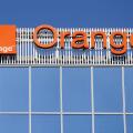 Bucharest, Romania - August 16, 2021: A logo of Orange, French telecommunications company, is displayed on the top of a building, in 'Pipera' neighbor