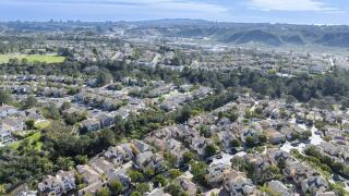 Aerial view of middle class subdivision neighborhood with residential condos and houses in San Diego, California, USA, North America