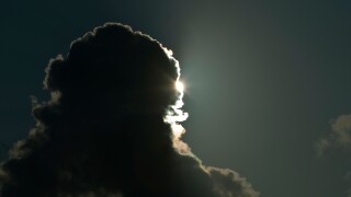 The sun behind rain clouds, Huntington Beach State Park, South Carolina, USA.