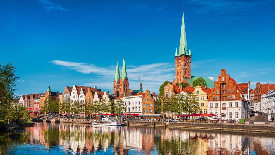 Historic skyline along the Trave river in the old town of Lubeck, Germany on a summer day