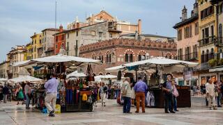 Verona, Italy. The Piazza delle Erbe is one of the tourist hotspots in Verona, filled with souvenir stalls of a vivid market