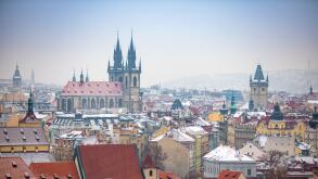 View of Old Town Prague City in snowy foggy day in the winter, Czech republic