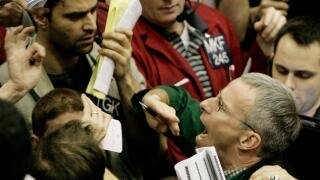 Traders shout in the Eurodollar options trading pit Wednesday, Jan. 30, 2008, at the Chicago Mercantile Exchange. Wall Street surged higher Wednesday after the Federal Reserve, confirming that there is increasing stress on the economy, cut interest rates 