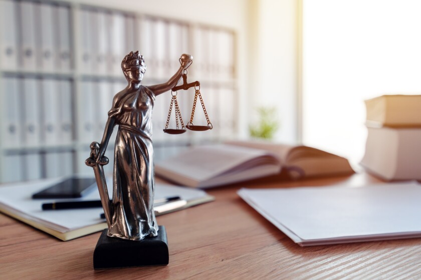 Lady Justice statue in law firm office