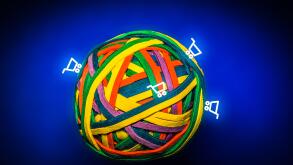 Ball of Colorful Rubber Bands Symbolising the Earth with Shopping Carts