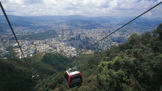 Venezuela - Caracas. The cable car in the Parque Nacional El Avila. In the background the city seen from above