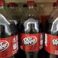 FILE - This April 28, 2016, file photo shows bottles of Dr. Pepper on a store shelf at Quality Cash Market in Concord, N.H. Keurig is buying Dr. Pepper Snapple Group Inc. to create a beverage business with approximately $11 billion in annual sales, announ