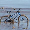 Bike stuck in river mud at New Brighton, Mereyside.