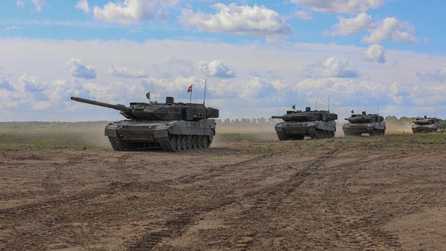 Leopard 2 tanks assigned to the Royal Danish Army advance onto the field during a multinational live-fire exercise at Mielno Range, Poland, May 27, 2022. Defender Europe 22 is a series of U.S. Army Europe and Africa multinational training exercises in Eas