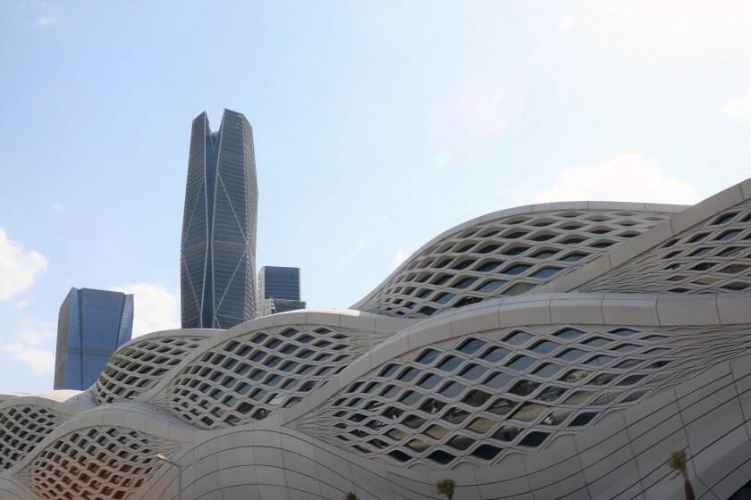 The Public Investmet Fund?s PIF Tower rises above the Zaha Hadid-designed Riyadh Metro station in the King Abullah Financial District in Saudi Arabia
