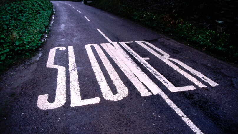 Slower Road Sign