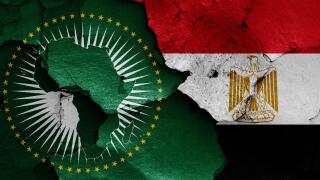 flags of Africa Union and Egypt painted on cracked wall